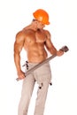 Young and handsome builder with a sledgehammer and Royalty Free Stock Photo