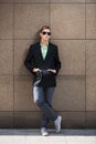 Young handsome business man in black blazer and sunglasses Royalty Free Stock Photo