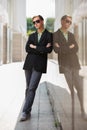 Young handsome business man in black blazer and sunglasses Royalty Free Stock Photo