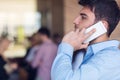 A young, handsome business man at the office building on phone Royalty Free Stock Photo