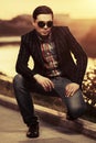 Young handsome business man in sunglasses on city street Royalty Free Stock Photo