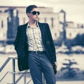 Young handsome business man in sunglasses in city street Royalty Free Stock Photo