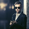 Young handsome business man using smart phone in a night city street Royalty Free Stock Photo