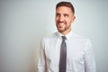 Young handsome business man wearing elegant white shirt over isolated background looking away to side with smile on face, natural Royalty Free Stock Photo