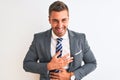 Young handsome business man wearing suit and tie over isolated background smiling and laughing hard out loud because funny crazy Royalty Free Stock Photo