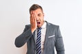 Young handsome business man wearing suit and tie over isolated background Yawning tired covering half face, eye and mouth with Royalty Free Stock Photo