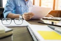 Young handsome business man working with documents in the office Royalty Free Stock Photo