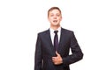 Young handsome businessman in black suit is standing straight, portrait isolated on white background Royalty Free Stock Photo
