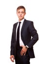 Young handsome businessman in black suit is standing straight, portrait isolated on white background Royalty Free Stock Photo