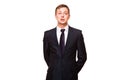 Young handsome businessman in black suit is standing straight, portrait isolated on white background Royalty Free Stock Photo