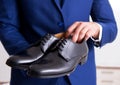 Young handsome businessman choosing shoes at home Royalty Free Stock Photo