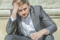 Young handsome businessman in depression. Problems with business. Difficulty, fiction, bankruptcy concept Royalty Free Stock Photo