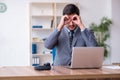 Young handsome businessman employee working in the office Royalty Free Stock Photo