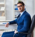 Young handsome businessman employee working in office at desk Royalty Free Stock Photo