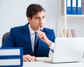 Young handsome businessman employee working in office at desk Royalty Free Stock Photo