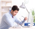 Young handsome businessman employee working in office at desk Royalty Free Stock Photo