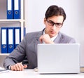 Young handsome businessman employee working in office at desk Royalty Free Stock Photo