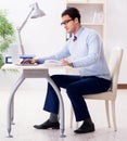 Young handsome businessman employee working in office at desk Royalty Free Stock Photo