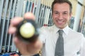 Young handsome businessman holding billiard ball Royalty Free Stock Photo