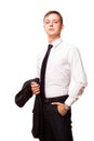 Young handsome businessman is holding a jacket in his one hand and the other hand in his pocket. portrait isolated on Royalty Free Stock Photo