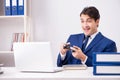 The young handsome businessman playing computer games at work office Royalty Free Stock Photo