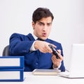 Young handsome businessman playing computer games at work office Royalty Free Stock Photo