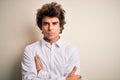 Young handsome businessman wearing elegant shirt standing over isolated white background skeptic and nervous, disapproving Royalty Free Stock Photo