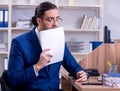 Young handsome businessman working in the office Royalty Free Stock Photo