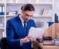 Young handsome businessman working in the office Royalty Free Stock Photo