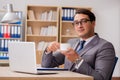 The young handsome businessman working on office Royalty Free Stock Photo