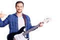 Young handsome caucasian man playing electric guitar pointing finger to one self smiling happy and proud Royalty Free Stock Photo