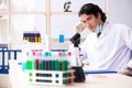 The young handsome chemist working in the lab Royalty Free Stock Photo