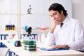 Young handsome chemist working in the lab Royalty Free Stock Photo