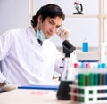 Young handsome chemist working in the lab Royalty Free Stock Photo