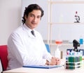 Young handsome chemist working in the lab Royalty Free Stock Photo