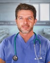 Young handsome and confident medicine doctor posing cheerful on blue scrubs and stethoscope on his neck smiling happy isolated on