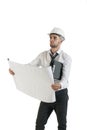 Young handsome construction technician reading drawing plans on white Royalty Free Stock Photo