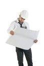 Young handsome construction technician reading drawing plans on white Royalty Free Stock Photo