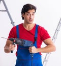 Young handsome contractor working indoors Royalty Free Stock Photo