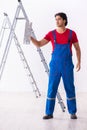 Young handsome contractor working indoors Royalty Free Stock Photo