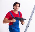 Young handsome contractor working indoors Royalty Free Stock Photo