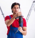 Young handsome contractor working indoors Royalty Free Stock Photo