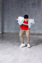 Young handsome dancer on grey background. Royalty Free Stock Photo