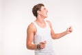 Young handsome dancing man on a white background