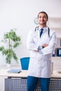 Young male handsome doctor working in the clinic Royalty Free Stock Photo