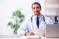 Young male handsome doctor working in the clinic Royalty Free Stock Photo