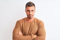 Young handsome elegant man wearing winter sweater over isolated background skeptic and nervous, disapproving expression on face Royalty Free Stock Photo