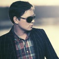 Young fashion man in sunglasses at sunset Royalty Free Stock Photo