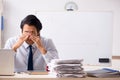 The young handsome financial speciaist in front of white board Royalty Free Stock Photo