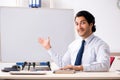 The young handsome financial speciaist in front of white board Royalty Free Stock Photo